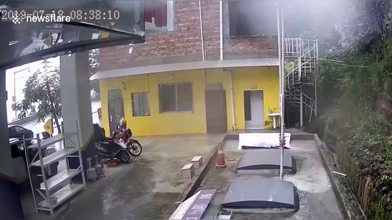 People flee from petrol station in southern China as massive landslide approaches