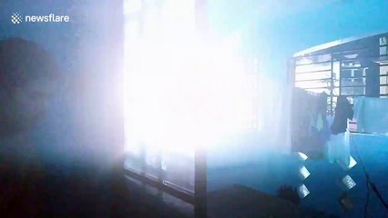 Terrifying moment power lines explode outside resident's bedroom window in the Philippines