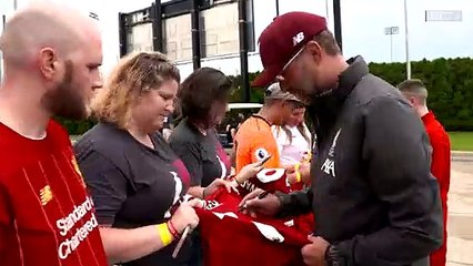 Jurgen Klopp gets a surprise when an LFC fan hugs him