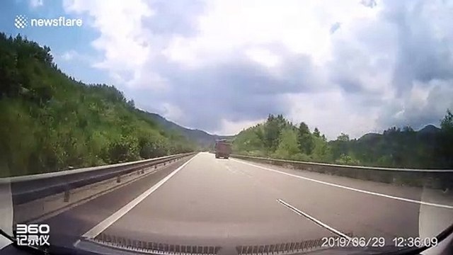 Planks flying off truck smash trailing car's windscreen in China