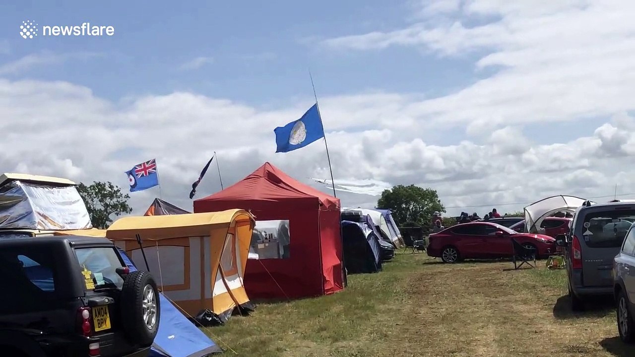 Flypast of a 747 in historic BOAC livery, alongside the Red Arrows