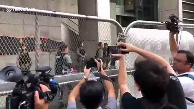 Hong Kong police erect barricades outside HQ as a major protest is held