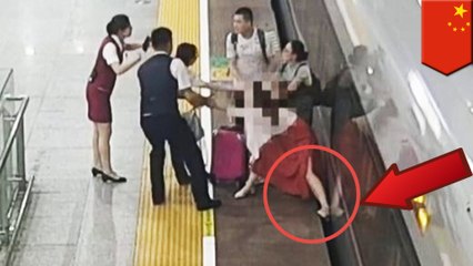A woman stops a train fromleaving by using her foot