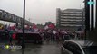 Protesters continue to march amid heavy rain