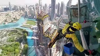 Fearless workers risk their lives cleaning the windows of the worlds tallest skyscraper in Dubai