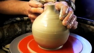 A ceramic clay pottery Apple on the wheel