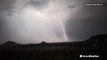 Bolts of lightning leap from the clouds during nighttime thunderstorm