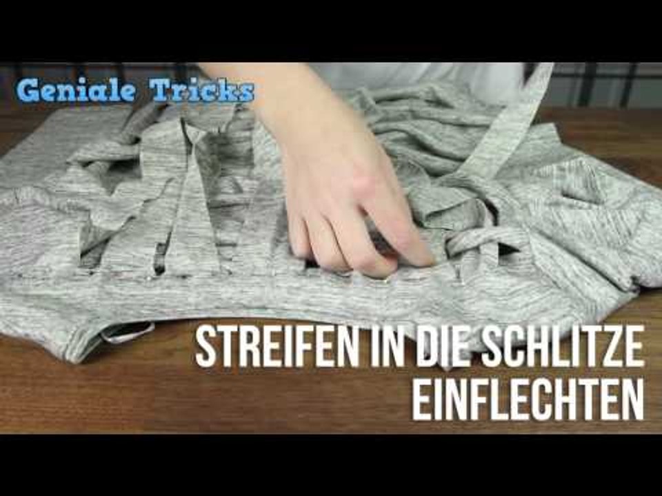 Zuerst schneidet die Frau den Pulli in Fetzen, danach flicht sie.