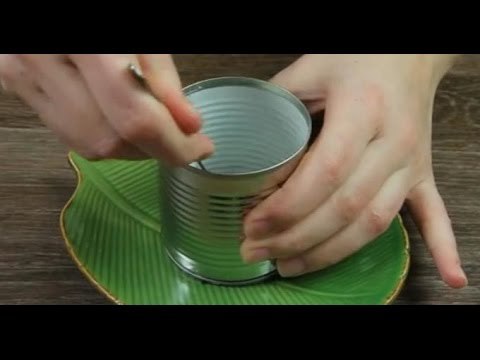 This man layers food in an empty bottomless can. You'll be speechless when he's done.