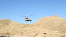 Shooting Machine gun out of helicopter