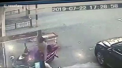 Concrete block hits woman with baby in arms after falling from building in China