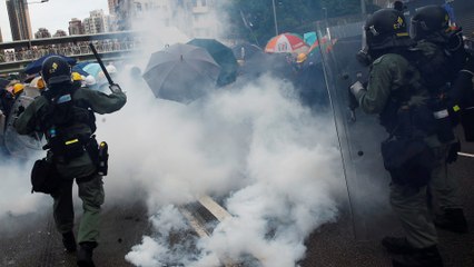 Police fire tear gas at Hong Kong protesters in Yuen Long, as tens of thousands join illegal march