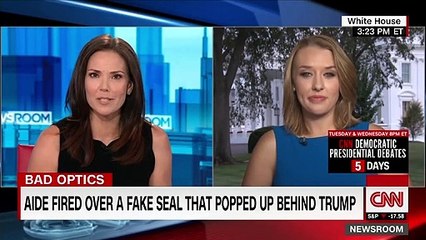 Aide fired after Trump appears with doctored presidential seal
