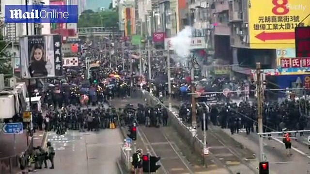 Thousands of protesters met with riot police and teargas in Hong Kong