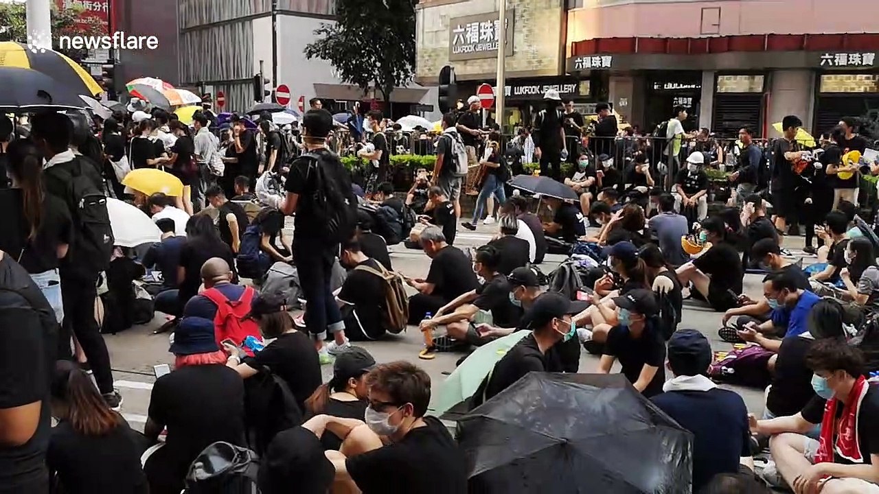 Protesters occupy a street in Hong Kong's Causeway Bay shopping district
