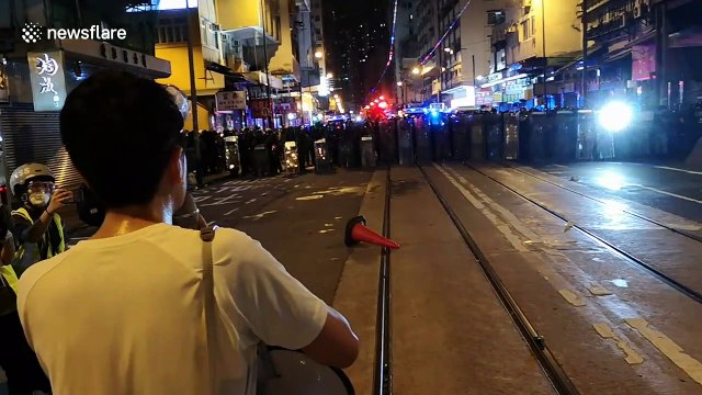 Hong Kong lawmaker tries to persuade police to let protesters retreat