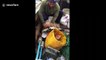 Fisherman rescues sea turtle tangled in mass of rubbish floating off Thailand