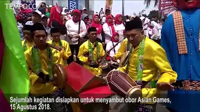 Warga Antusias Sambut Obor Asian Games