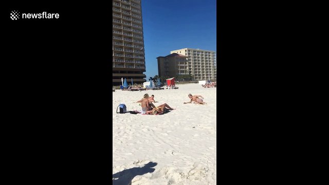 Beach bros use backflips to impress women on Florida beach