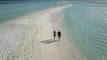 Couple Walking on a Beach Filmed with a Drone　金本朝樹