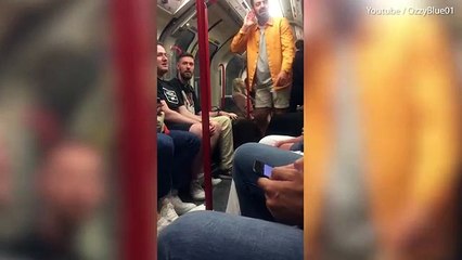 Moment 'drunken' chanting Chelsea fan shoved off London tube