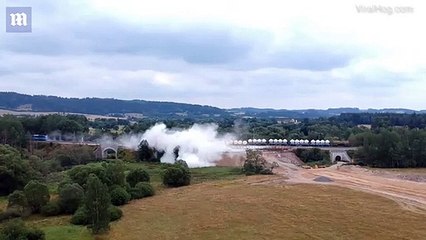Drone catches moment train derails after heavy load forces it over