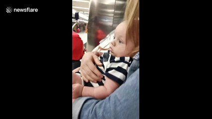 Woman bursts into tears after seeing her newborn nephew for the first time at LA airport