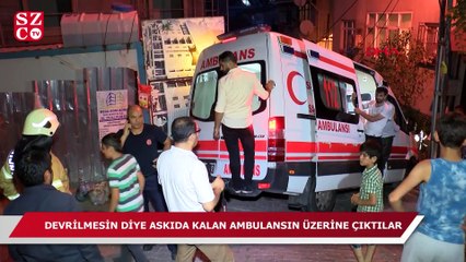 Ambulans devrilmesin diye üstüne çıktılar