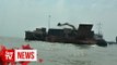 Ship captain and engineer held for dumping coal dust at sea