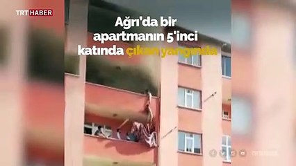 Çocuklarını yangından battaniyeye atarak kurtardı