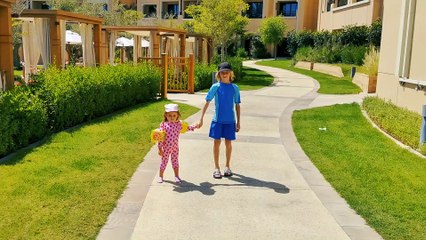 Little Mia and her brother playing in water park. Kids entertainment in aqua park Abu Dhabi. Part 1