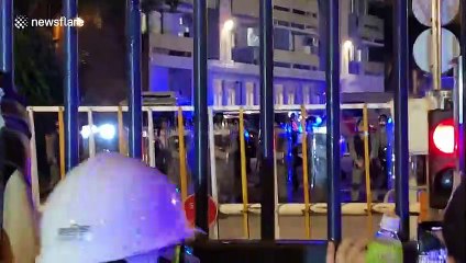 Crowds scream expletives at Hong Kong police as they lay siege to Kwun Tong Police Station in Kowloon