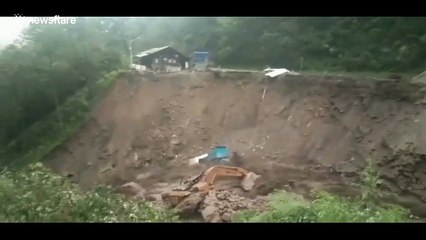 Portacabin and truck fall into river during massive mudslide in China