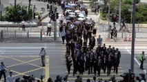 Dressed in black, thousands of Hong Kong lawyers marched in silence to slam ‘political prosecution’ of arrested extradition bill protesters