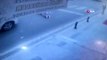 Ataşehir'de kadının yolda ilerleyen otomobilin üzerine düştüğü anlar kamerada