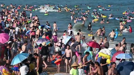 China beach fans never without their inflatable