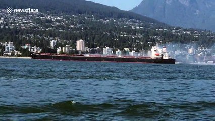 Incredible moment Canadian tanker is engulfed in pillar of smoke