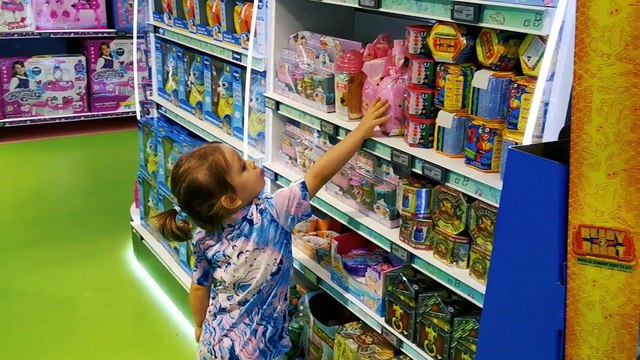 Little Mia is shopping in toy shop in the Mall of The Emirates Dubai.
