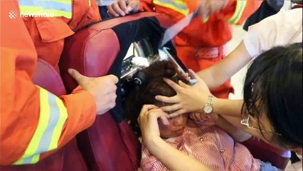 Firefighters free woman's hair from massage chair in China