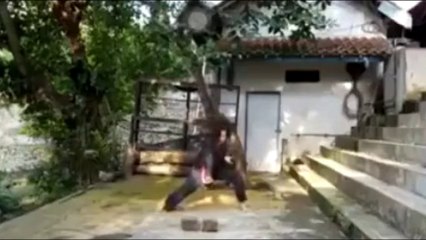 The girl breaks the stone without touching it. Is this Qi Energy?