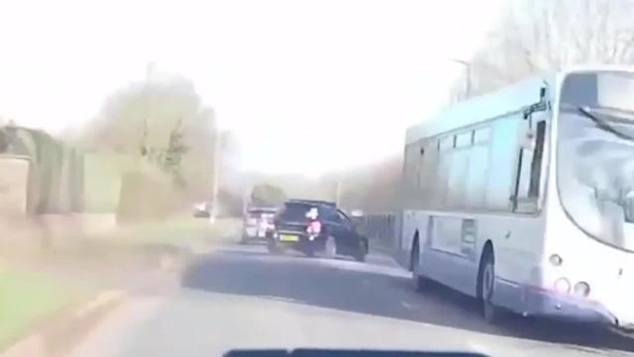 SWNS - This is the shocking moment a reckless driver smashed head-on into a woman's car, leaving her with life-changing injuries