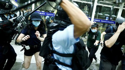 Flights resume after night of violence at Hong Kong's airport