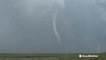 Large rope tornado touches down during severe storm