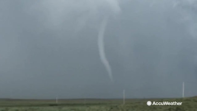 Large rope tornado touches down during severe storm