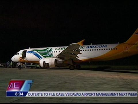 Stranded passengers celebrate reopening of Davao Airport