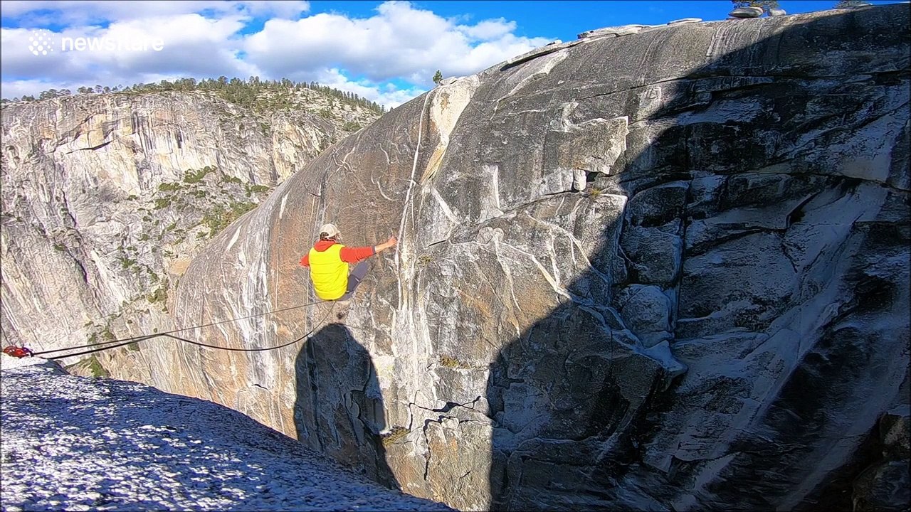 Insane moment thrill seeker traverses 1500 foot drop over mountain with NO net