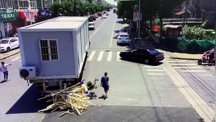 Woman run over by truck after falling out of a three-wheeler in eastern China