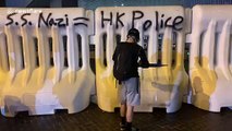 Hong Kong activists spray 