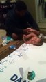 Dad Hilariously Struggles with Baby During Diaper Change