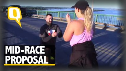 American Man Pauses at Marathon, Proposes to Canadian Girlfriend